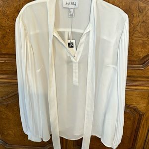 Joseph Ripkoff white blouse with pleated sleeves.